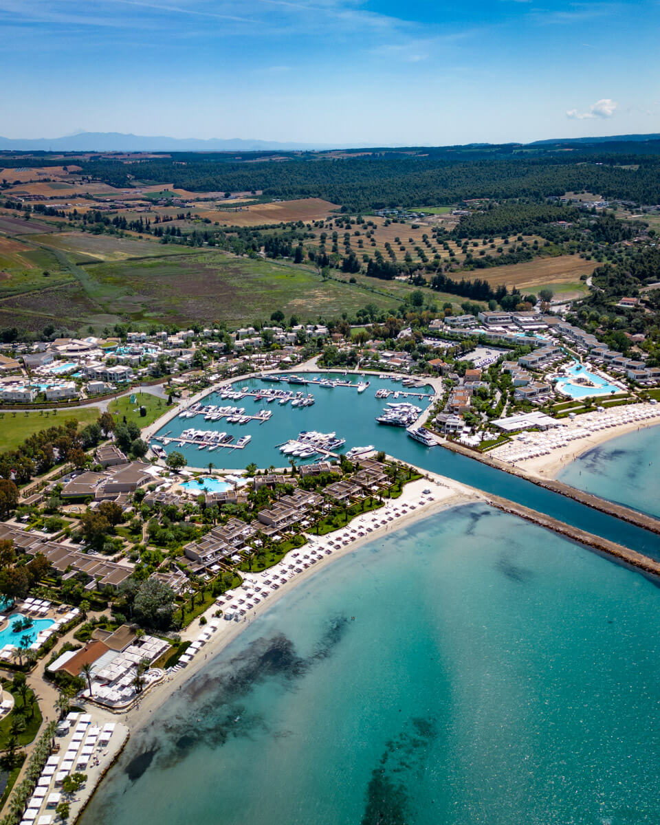 Sani Resort marina with luxury yachts and beachfront hotels on the Kassandra peninsula of Halkidiki
